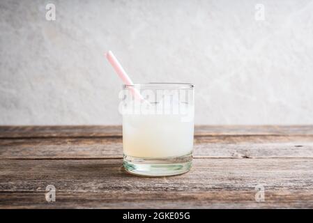 Old fashioned lychee cocktail on the rustic background. Selective focus. Shallow depth of field. Stock Photo