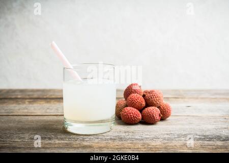 Old fashioned lychee cocktail on the rustic background. Selective focus. Shallow depth of field. Stock Photo