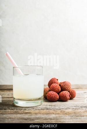 Old fashioned lychee cocktail on the rustic background. Selective focus. Shallow depth of field. Stock Photo