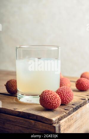 Old fashioned lychee cocktail on the rustic background. Selective focus. Shallow depth of field. Stock Photo