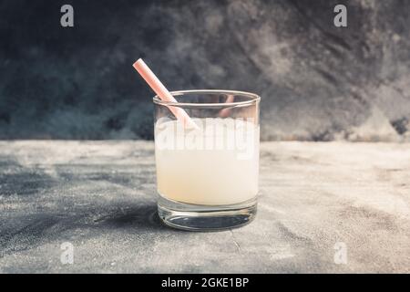 Old fashioned lychee cocktail on the rustic background. Selective focus. Shallow depth of field. Stock Photo