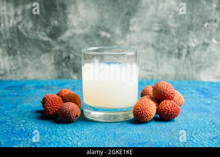 Old fashioned lychee cocktail on the rustic background. Selective focus. Shallow depth of field. Stock Photo