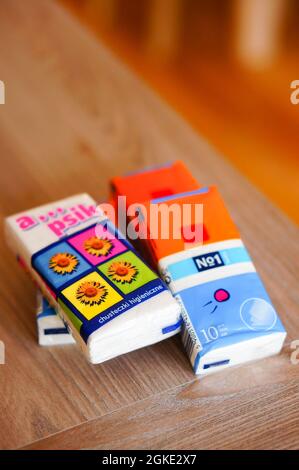 POZNAN, POLAND - Jan 18, 2015: A selective closeup of a set of soft white tissues packed in plastic on a table Stock Photo