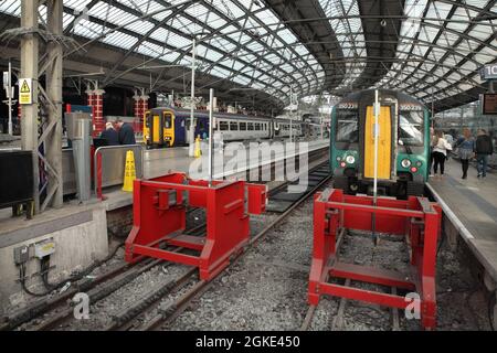 Northern class 156 DMU 156461 and London Northwestern Railway Class 350 'Desiro' electric multiple unit 350239 at Liverpool Lime Street station, UK. Stock Photo