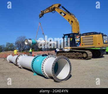 Components for the pump at the lift station are being installed as part ...