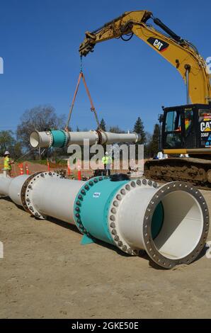 Components for the pump at the lift station are being installed as part ...