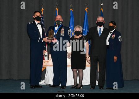 Senior Master Sgt. Courtney M. Sartain, one of Barksdale's newest chief master sergeant selects, and his family, pose for a photo during the 2021 Chief Master Sgt. Recognition ceremony at Barksdale Air Force Base, Louisiana, March 26, 2021. Twelve senior master sergeants were recognized as part of the one percent of the Air Force that holds the rank of chief master sergeant. Stock Photo