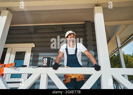 Civil engineer checking ceiling of house porch Stock Photo