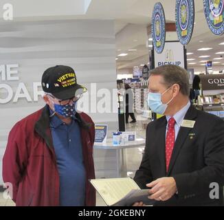 NEX Annapolis, Maryland, honored Vietnam War Veterans with a lapel pin on March 29, National Vietnam War Veterans Day. The Navy Exchange Service Command (NEXCOM) is comprised of 14,000 personnel worldwide facilitating six business lines, NEX retail stores, the Navy Lodge Program, Telecommunications Program, Navy Clothing and Textile Research Facility, Ships Store Program and the Uniform Program Management Office. Stock Photo