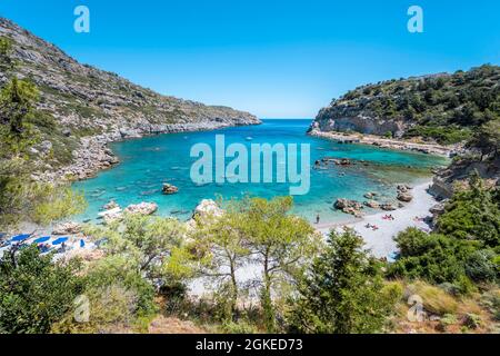 Beach and turquoise waters, Anthony Quinn Bay, Faliraki, Rhodes, Dodecanese, Greece Stock Photo