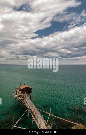 At the foot of the ancient village of Termoli, the Promenade of the Trabucchi winds its way, a portion of the coast from which you have access to the Stock Photo