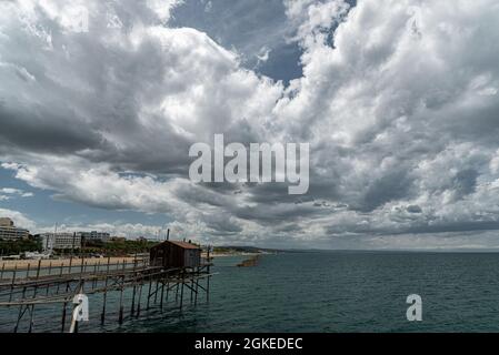 At the foot of the ancient village of Termoli, the Promenade of the Trabucchi winds its way, a portion of the coast from which you have access to the Stock Photo