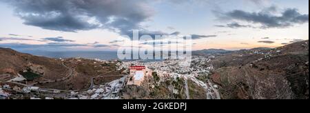 Aerial view of the church Agios Giorgios, view from Ano Syros to houses of Ermoupoli, Anastasi church in the evening light, sea with islands, Ano Stock Photo