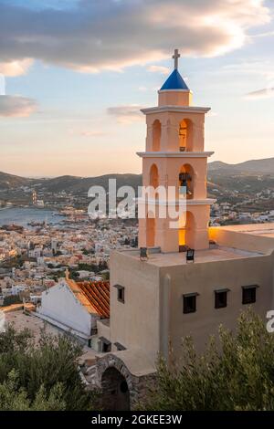 View from Ano Syros to houses of Ermoupoli, church in evening light, sea with islands, Ano Syros, Syros, Cyclades, Greece Stock Photo