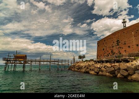 At the foot of the ancient village of Termoli, the Promenade of the Trabucchi winds its way, a portion of the coast from which you have access to the Stock Photo