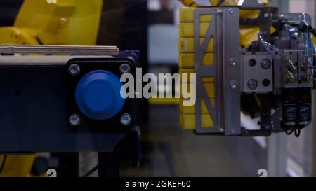 Commercial production concept, robotic automated equipment in action. HDR. Close up of Industrial machine at the modern factory Stock Photo