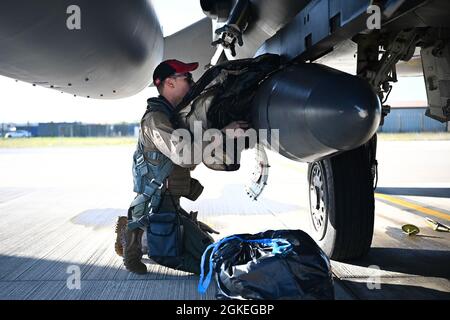 Capt. Dylan McKeever, 494th Fighter Squadron weapon systems officer,  performs pre-flight checks before taking off from Royal Air Force  Lakenheath, England, March 30, 2021. Airmen from the 494th FS and across the