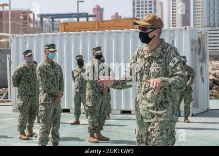 Task Force 56 Commander of Task Force 56 addresses Sailors during awards quarters at ...
