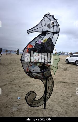El Dorado, Peru - July 30, 2021: Waste bin shaped as a seahorse located on beach Stock Photo