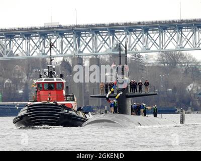 210401-N-AY957-079 GROTON, Conn. (April 1, 2021) – The Los Angeles-class submarine USS Providence (SSN 719) transits under the Gold Star Memorial Bridge toward Naval Submarine Base New London in Groton, Conn., April 1. Providence returned to homeport from its 16th and final deployment in support of the Navy's maritime strategy - supporting national security interests and maritime security operations - in the 7th Fleet area of operations. Stock Photo