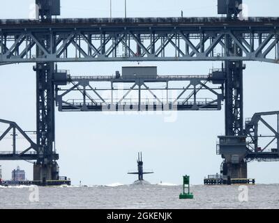 210401-N-AY957-017 GROTON, Conn. (April 1, 2021) – The Los Angeles-class submarine USS Providence (SSN 719) transits under the Gold Star Memorial Bridge toward Naval Submarine Base New London in Groton, Conn., April 1. Providence returned to homeport from its 16th and final deployment in support of the Navy's maritime strategy - supporting national security interests and maritime security operations - in the 7th Fleet area of operations. Stock Photo