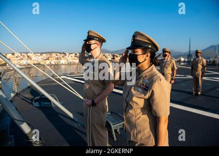 210401-N-EI510-0202 GAETA, Italy (April 1, 2021) The Chief's Mess salute the American Flag during morning colors aboard the Blue Ridge-class command and control ship USS Mount Whitney in Gaeta, Italy, April 1, 2021. Mount Whitney, forward deployed to Gaeta, Italy operates with a combined crew of Sailors and Military Sealift Command civil service mariners in the U.S. Sixth Fleet area of operations in support of U.S. national security interests in Europe and Africa. Stock Photo