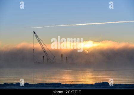 Construction Marine offshore works. Dam building, crane, barge, dredger. Breakwater construction. Stock Photo