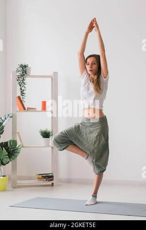 Fit Smiling Woman Practicing Tree Yoga Pose in Cozy Place Stock Photo -  Image of harmony, practicing: 286030458