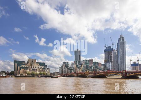 Vauxhall London; River Thames London at Vauxhall, with Vauxhall Bridge, the MI6 building, modern flats and other new building work, London UK Stock Photo