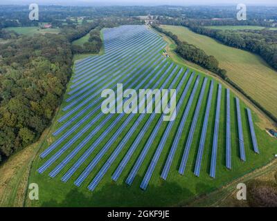 Aerial view of a large commercial solar panel generating plant producing clean green energy to the national electricity grid, (West Sussex) UK Stock Photo