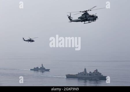 210407-M-JX780-1784 BAY OF BENGAL (April 7, 2021) – Clockwise, from top left, an Australian Royal Navy MH-60 Sea Hawk and a U.S. Marine Corps AH-1Z Viper assigned to Marine Medium Tiltrotor Squadron 164 (Reinforced), 15th Marine Expeditionary Unit, fly over the amphibious transport dock ship USS Somerset (LPD 25), right, and Japan Maritime Self-Defense Force ship, JS Akebono (DD 108), while the ships maneuver in formation through the Bay of Bengal during La Perouse 2021. La Perouse is an exercise during the annual French Navy midshipman deployment called Mission Jeanne d'Arc. The exercise is d