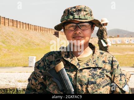 U.S. Marine Corps Rct. Yasmine Delarosa with Lima Company, 3rd Recruit Training Battalion, poses for a photo at Edson Range aboard Marine Corps Base Camp Pendleton, California, April 11, 2021. Delarosa explained she realized that you cannot depend everything on strictly motivation. “Recruit training has made me stronger mentally, and I know now that I need to rely on myself, not just others pushing me,” says Delarosa, who is a native of Lakewood, California. She was recruited out of Recruiting Station Orange County. Stock Photo