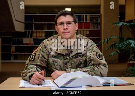 2nd Lt. James Kimball, a former explosive ordnance specialist, studies an anatomy text in the library at the Uniformed Services University of Health Sciences in Bethesda, Maryland. Kimball will graduate medical school, and pin on the rank of captain, in May. Stock Photo