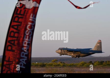 A C-130 Hercules assigned to the Air National Guard Air Force Reserve Command Test Center takes off from the Marana National Airport, Marana, Arizona, April 8, 2021. The AATC C-130 Hercules Test Detachment from Little Rock Air Force Base, Arkansas, worked alongside the 563rd Rescue Group to perform operational tests on the LITENING targeting pod, a high-resolution, multi-sensor targeting system designed for finding, fixing and targeting enemy target sets. Stock Photo