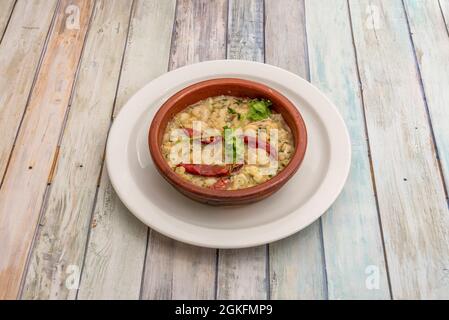 Typical Spanish tapa of garlic prawns fried in olive oil with spicy cayenne served in clay pot Stock Photo