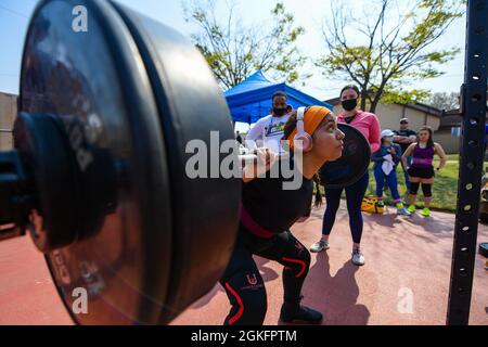 A competitor performs a squat during a power lifting competition at ...