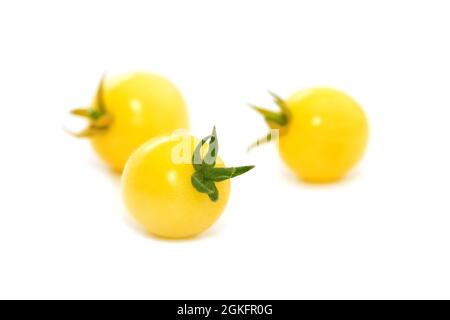 Yellow cherry tomatoes isolated on white Stock Photo