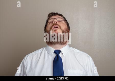 bored man in a dress up shirt Stock Photo