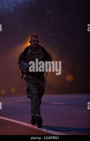 U.S. Army Sgt. 1st Class Nicholas Waddell conducts the 26-mile Bataan Memorial Death March on Fort George G. Meade, Maryland, April 10, 2021. The Bataan Death March took place in April 1942, where American and Filipino prisoners of war were forced to walk 66 miles. Stock Photo