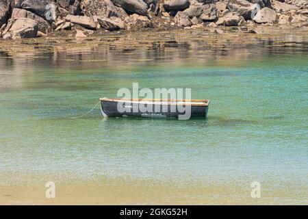 A small boat in Kitchen Porth, Bryher, Isles of Scilly Stock Photo
