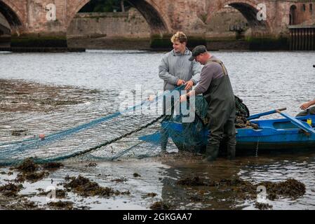 Berwick upon Tweed, Northumberland, England, UK, 14 September 2021. The last tide of the 2021 salmon netting season on the River Tweed for the fishermen at Gardo fishery at Berwick upon Tweed, fishers have worked this fishery from before medieval times using the same method of fishing. Gardo pronounced Gardi, the name only survives in its orginal form because of its use by the fishermen the name was wrongly transcribed from medieval writing. Gardo is also the last commercial salmon netting station on the Tweed. Stock Photo