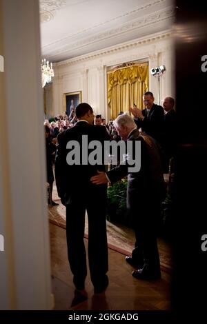 President Barack Obama and Sen. Edward Kennedy, D-Mass., enter the East Room of the White House, to attend a Health Care Summit with members of Congress, March 5, 2009. (Official White House Photo by Pete Souza) This official White House photograph is being made available only for publication by news organizations and/or for personal use printing by the subject(s) of the photograph. The photograph may not be manipulated in any way and may not be used in commercial or political materials, advertisements, emails, products, promotions that in any way suggests approval or endorsement of the Presid Stock Photo