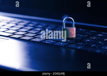 Cybersecurity concept, padlock on laptop computer keyboard. Stock Photo