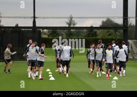 Kirkby, Knowsley, Merseyside, England, 14th September 2021: The AXA Training Centre, Kirkby, Knowsley, Merseyside, England: Liverpool FC training ahead of Champions League game versus AC Milan on 15th September: the Liverpool players begin their warm up supervised by fitness coach Andreas Kornmeyer Stock Photo