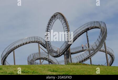 Duisburg September 2021: Tiger and Turtle - Magic Mountain is a landmark modeled on a roller coaster on Heinrich-Hildebrand-Höhe in Angerpark in Duisb Stock Photo