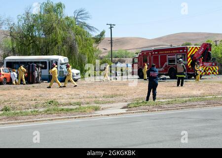 A California first responder fire truck and response team arrive at the scene of a simulated car-wreck caused by a radiological explosion, April 16, 2021, in Concord, Calif.. California first responder units and elements of the California National Guard and Hawaii Air National Guard were participating in exercise Sentinel Response. Sentinel Response 2021 is a full scale exercise that provides local and state first responders and elements of the California Army and Air National Guard with the opportunity to conduct Urban Search & Rescue Stock Photo