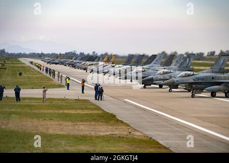 Aircraft from several countries participating in INIOCHOS 21 line up prior to an elephant walk at Andravida Air Base, Greece, April 18, 2021. Elephant walks are a show of force, demonstrating the might and power of the U.S. Air Force and its allies. The 510th Fighter Squadron participated in INIOCHOS 21, a Hellenic air force-led exercise designed to enhance the interoperability and skills of allied and partner air forces in the accomplishment of joint operations and air defenses. Stock Photo