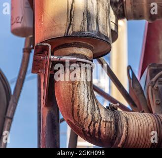 detail image of a pipe and canister on a diesel engine Stock Photo