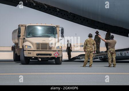 An R-11 fuel truck is parked to start a refueling event with a U.S. Air ...