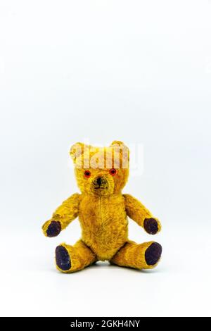 old 1960s teddy bear on white studio background Stock Photo